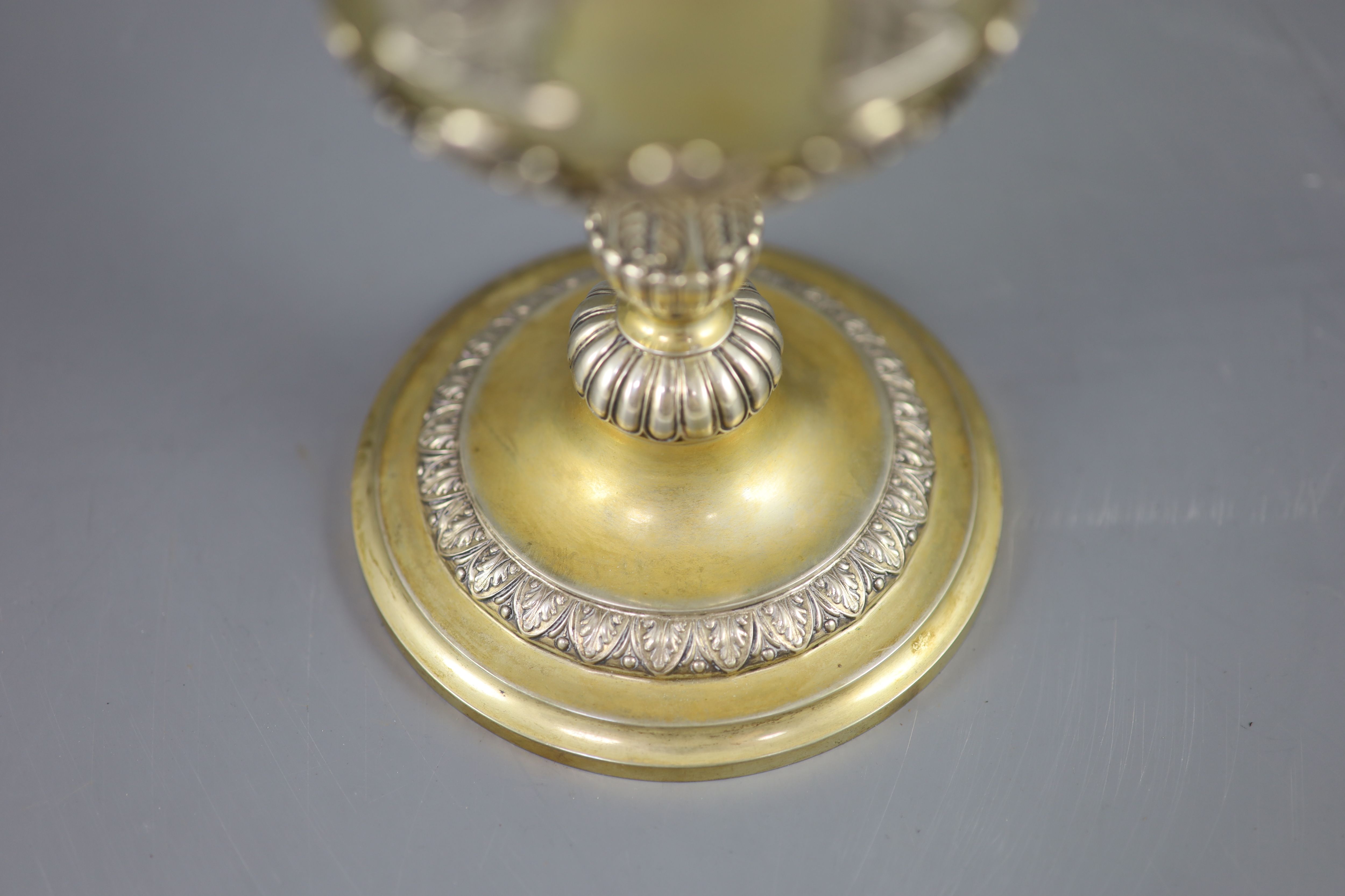 A late 19th/early 20th century German parcel gilt 800 standard presentation pedestal cup and cover, by Wollenweber,